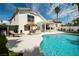 Backyard oasis featuring a sparkling pool, lush landscaping, and outdoor kitchen at 222 Hollyfern St, Henderson, NV 89074