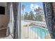 Balcony view of a pool with a covered patio and lush landscaping at 222 Hollyfern St, Henderson, NV 89074
