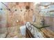 Stylish bathroom with unique tile work, a glass countertop sink, and modern fixtures at 222 Hollyfern St, Henderson, NV 89074