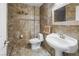 Tiled bathroom featuring a toilet, and single sink with mirror at 222 Hollyfern St, Henderson, NV 89074