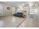 Open-concept living room featuring large windows with shutters, neutral walls, and tile flooring at 222 Hollyfern St, Henderson, NV 89074