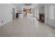 Open-concept living room showcasing a fireplace, wet bar, staircase, and tile floors at 222 Hollyfern St, Henderson, NV 89074