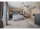 A spacious primary bedroom features a ceiling fan, sitting area, and a balcony at 222 Hollyfern St, Henderson, NV 89074