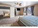 A spacious primary bedroom features a ceiling fan, sitting area, and a balcony at 222 Hollyfern St, Henderson, NV 89074