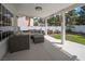 Comfortable covered outdoor seating area with plush sofas and a view of the landscaped backyard at 222 Hollyfern St, Henderson, NV 89074