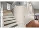 An elegant staircase with decorative runners leads to the upper level of the home at 222 Hollyfern St, Henderson, NV 89074
