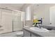 Bright bathroom with a shower, vanity, and tiled floors, creating a clean and functional space at 2272 Platinum Band St, Las Vegas, NV 89156