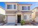 Charming two-story home features a well-maintained lawn and a welcoming front entrance with attached garage at 2272 Platinum Band St, Las Vegas, NV 89156