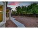 Backyard area with gravel landscape, a concrete walkway, and privacy walls at 2579 Ivoryhill St, Las Vegas, NV 89135