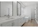 Modern bathroom featuring double vanity, soaking tub, and glass enclosed shower at 2579 Ivoryhill St, Las Vegas, NV 89135