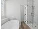 Bright bathroom showcasing a modern soaking tub and glass enclosed shower at 2579 Ivoryhill St, Las Vegas, NV 89135