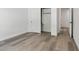 Bedroom featuring wood flooring and closet with white bi-fold doors at 2579 Ivoryhill St, Las Vegas, NV 89135
