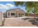 Back exterior of house with covered patio and desert landscaping at 2579 Ivoryhill St, Las Vegas, NV 89135