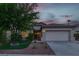 Charming single-story home with a well-maintained lawn, two car garage and desert landscaping at 2579 Ivoryhill St, Las Vegas, NV 89135