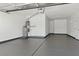 Spacious two car garage with sealed concrete floor, storage, and access door at 2579 Ivoryhill St, Las Vegas, NV 89135