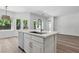 Bright kitchen featuring a large island with a sink and modern appliances at 2579 Ivoryhill St, Las Vegas, NV 89135