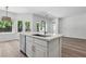 Bright, open kitchen with a large island, stainless steel sink, and hardwood floors, perfect for entertaining at 2579 Ivoryhill St, Las Vegas, NV 89135