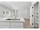 Spacious kitchen featuring an island with modern fixtures, complemented by an open layout and bright natural light at 2579 Ivoryhill St, Las Vegas, NV 89135