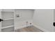 Functional laundry room with shelving and utility connections at 2579 Ivoryhill St, Las Vegas, NV 89135