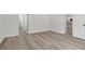 Bright living room featuring light hardwood floors and fresh neutral paint at 2579 Ivoryhill St, Las Vegas, NV 89135