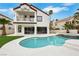 Inviting pool and lush backyard with ample space for recreation, complemented by a beautiful home exterior at 2589 Sun Reef Rd, Las Vegas, NV 89128