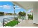 Balcony view overlooking a lake, tropical trees, and pool, perfect for relaxation and entertainment at 2589 Sun Reef Rd, Las Vegas, NV 89128
