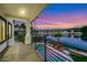 An outdoor balcony overlooking a lake with palm trees and scenic views at 2589 Sun Reef Rd, Las Vegas, NV 89128
