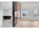 Luxurious primary bathroom features a soaking tub, lake view, and marble accent wall at 2589 Sun Reef Rd, Las Vegas, NV 89128