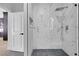 Modern bathroom with a glass-enclosed shower and stylish marble-like tile at 2589 Sun Reef Rd, Las Vegas, NV 89128