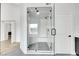 Modern bathroom with a glass-enclosed shower and geometric tile flooring, adding a sleek and contemporary touch at 2589 Sun Reef Rd, Las Vegas, NV 89128