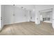 Bedroom features a large window, wood-style flooring, and modern lighting at 2589 Sun Reef Rd, Las Vegas, NV 89128