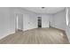 Spacious bedroom with wood-look flooring and ample natural light, ready for personalized decoration at 2589 Sun Reef Rd, Las Vegas, NV 89128