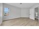 Light-filled bedroom with neutral walls and wood-look floors at 2589 Sun Reef Rd, Las Vegas, NV 89128