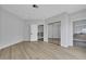 Spacious bedroom with mirrored closet doors and wood-look floors at 2589 Sun Reef Rd, Las Vegas, NV 89128