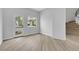 Bright bedroom with hardwood floors, a modern doorway, and lots of natural light at 2589 Sun Reef Rd, Las Vegas, NV 89128