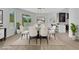 Bright dining room with a glass table, white chairs, and views of the outdoors at 2589 Sun Reef Rd, Las Vegas, NV 89128