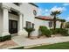 Inviting entrance with a walkway, desert landscaping, and a double-door entryway at 2589 Sun Reef Rd, Las Vegas, NV 89128