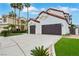 Stunning two-story home with a two-car garage, terracotta roof, and well-maintained landscaping at 2589 Sun Reef Rd, Las Vegas, NV 89128
