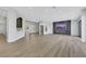 Spacious foyer featuring a staircase and views into the modern, open-concept living area at 2589 Sun Reef Rd, Las Vegas, NV 89128