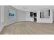Open-concept living space with modern lighting and light wood flooring at 2589 Sun Reef Rd, Las Vegas, NV 89128