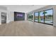 Spacious living area features modern fireplace, hardwood floors, and sliding glass doors to the backyard at 2589 Sun Reef Rd, Las Vegas, NV 89128