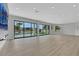 Bright living space offers recessed lighting, hardwood floors, and expansive views of the backyard pool at 2589 Sun Reef Rd, Las Vegas, NV 89128