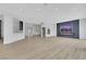 Open living space with modern fireplace adjacent to kitchen and entryway at 2589 Sun Reef Rd, Las Vegas, NV 89128