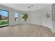 Bright living room with hardwood floors and modern lighting, with sliding doors to backyard at 2589 Sun Reef Rd, Las Vegas, NV 89128