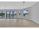 Open living room with recessed lights and lots of natural light from large windows facing the backyard pool at 2589 Sun Reef Rd, Las Vegas, NV 89128