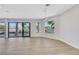 Open-concept living room with ample natural light and sliding doors to the outdoor pool area at 2589 Sun Reef Rd, Las Vegas, NV 89128