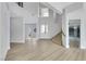 Open-concept living room with a grand entrance, light wood floors, and ample natural light at 2589 Sun Reef Rd, Las Vegas, NV 89128