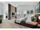 Staged main bedroom with platform bed, fireplace and TV at 2589 Sun Reef Rd, Las Vegas, NV 89128