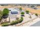 Wide aerial shot shows the home and detached garage, along with the expansive, fenced yard and landscaping at 2650 Sagebrush Ave, Pahrump, NV 89048