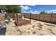 Backyard featuring garden beds and graveled ground at 2650 Sagebrush Ave, Pahrump, NV 89048
